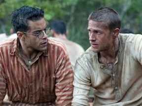 This image released by Bleecker Street shows Rami Malek, left, and Charlie Hunnam in a scene from "Papillon."