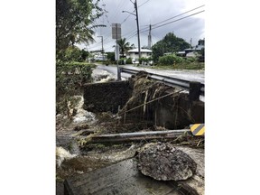 This photo provided by Jessica Henricks shows damage from Hurricane Lane Friday, Aug. 24, 2018, near Hilo, Hawaii. Hurricane Lane barreled toward Hawaii on Friday, dumping torrential rains that inundated the Big Island's main city as people elsewhere stocked up on supplies and piled sandbags to shield oceanfront businesses against the increasingly violent surf. The city of Hilo, population 43,000, was flooded with waist-high water.