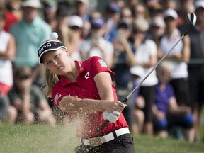 Brooke Henderson, of Smiths Falls, Ont., takes a shot out of the sand trap on the 17th green during the CP Women's Open in Regina, Friday, August, 24, 2018.