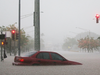 A car is partially submerged in floodwaters from Hurricane Lane rainfall on the Big Island on Aug. 23, 2018 in Hilo, Hawaii.