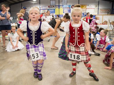 Sisters Kenzie McCrae, 7, (L) and Shelby McCrae, 5, show off their highland dance style as the Glengarry Highland Games begin on Friday to celebrate the 71st year.