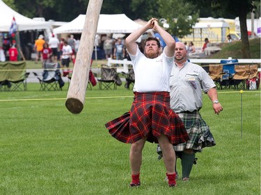 Rory Cameron competes in the caber toss as the Glengarry Highland Games.