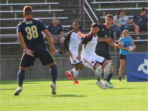 Fury FC's Chris Mannella gets caught between Bethlehem Steel FC's Santi Moar (38) and Drew Skundrich (39)  during Wednesday's match in Pennsylvania. Bethlehem Steel FC photo.