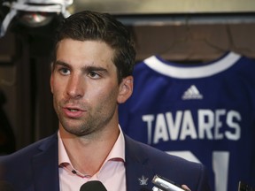 In this July 1, 2018 file photo, Toronto Maple Leafs forward John Tavares speaks to reporters after signing a seven-year, US$77-million contract.