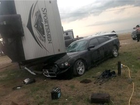 An overturned trailer is shown after a tornado at Margaret Bruce Beach, east of Alonsa, Man., on Friday, Aug.3, 2018. A tornado that touched down west of Lake Manitoba on Friday night tore at least one home off its foundation, a spokesman for Environment Canada said Saturday.