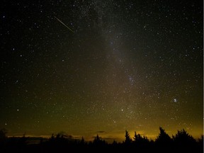 In this 30 second exposure, a meteor streaks across the sky during the annual Perseid meteor shower.