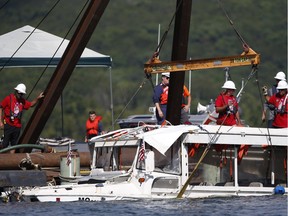 FILE - In this July 23, 2018, file photo, the duck boat that sank in Table Rock Lake in Branson, Mo., is raised.