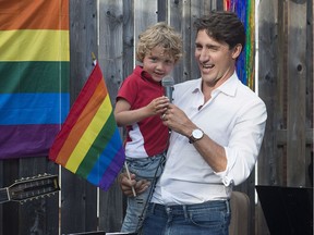 Prime Minister Justin Trudeau and his four-year-old son Hadrien attend a Fredericton Pride social event in Fredericton on Sunday, Aug. 12, 2018.