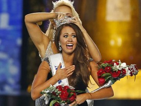 FILE – In this Sept. 10, 2017, file photo, Miss North Dakota Cara Mund reacts after being named Miss America during the Miss America 2018 pageant in Atlantic City, N.J.