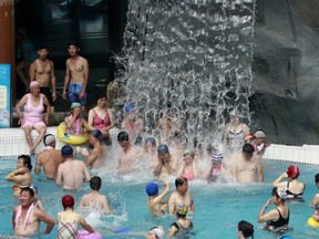 People spend their afternoon in an indoor swimming pool at Munsu Water Park during a hot day in Pyongyang, North Korea, Tuesday, July 24, 2018. The water park a popular entertainment facility for people living in the capital city.