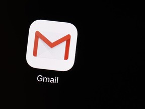 FILE- This March 20, 2018, file photo shows the Gmail app on an iPad in Baltimore. Google is toeing the line between helping you save time and creeping you out as it turns to machines to suggest email replies on your behalf. The customized auto-responses come in the latest version of Gmail on the web and expand on a feature already available on Android devices and iPhones.