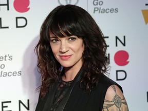 FILE - In this April 12, 2018 file photo, Italian actress and director Asia Argento arrives at the ninth annual Women in the World Summit in New York. Argento, one of the most prominent activists of the #MeToo movement against sexual harassment, recently settled a complaint filed against her by a young actor and musician who said she sexually assaulted him when he was 17, the New York Times reported.