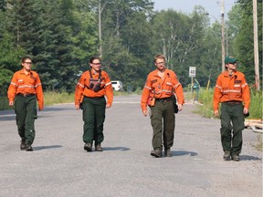 Ontario FireRangers are shown in an area near the fire known as "Parry Sound 33."