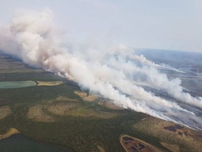 Smoke from the newest fires in the Cochrane sector, which are located to the south and west of the community of Fort Severn, Ont., is shown in an Aug.5, 2018 handout photo.