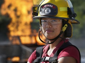 Poppy Stevens poses for a photo at the Ottawa Fire Services Training Centre in Ottawa Thursday Aug 16, 2018.