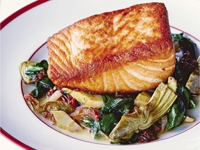 The Pan-seared Salmon with Artichokes and White Wine from Giada’s Italy, Giada De Laurentiis's eighth cookbook. (Aubrie Pick, Clarkson Potter / Penguin Random House)