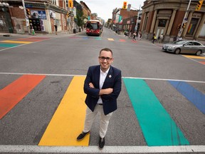 Toby Whitfield is the director of Capital Pride and he's at Bank and Somerset Streets where the majority of activities will take place. Photo by Wayne Cuddington/ Postmedia