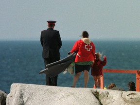 A little girl waves good-bye to her aunt who died in flight 111 during a visit to Peggy's Cove in 1999.