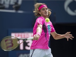 Stefanos Tsitsipas hits a forehand to Alexander Zverev during Rogers Cup quarterfinal play in Toronto on Friday.