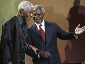 FILE - In this Sunday, July 22, 2007 file photo Nelson Mandela and former United Nations Secretary General Kofi Annan arrive together at the 5th Nelson Mandela Annual Lecture, held at the Linder Auditorium in Johannesburg, South Africa. Annan, one of the world's most celebrated diplomats and a charismatic symbol of the United Nations who rose through its ranks to become the first black African secretary-general, has died. He was 80. (AP Photo, File)