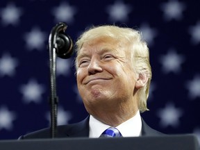 President Donald Trump pauses while speaking during a rally Tuesday, Aug. 21, 2018, in Charleston, W.Va.