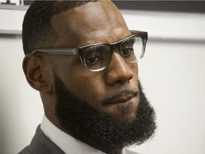 NBA superstar LeBron James is seen here in a July 30 photo taken during a news conference after the opening ceremony for the I Promise School in Akron, Ohio. AP Photo/Phil Long