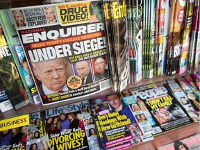 This July 12, 2017, file photo shows the cover of an issue of the National Enquirer featuring President Donald Trump at a store in New York.