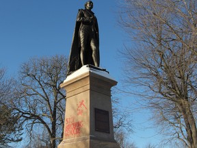 The statue of Sir John A Macdonald with the words "stop honouring genocide" spray-painted in red on the side in Kingston, Ont. on Thursday December 28, 2017.