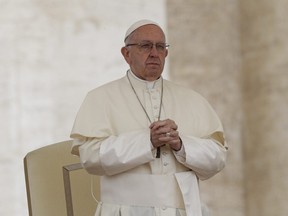 In this Wednesday, May 2, 2018 file photo Pope Francis prays during his weekly general audience, in St.Peter's Square at the Vatican. The Vatican said Thursday Aug. 2, 2018 that Pope Francis had changed the Catechism of the Catholic Church about the death penalty, saying it can never be sanctioned because it "attacks" the inherent dignity of all humans.