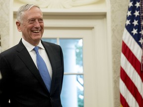 FILE - In this July 30, 2018, file photo, Defense Secretary Jim Mattis attends a swearing in ceremony for Robert Wilkie as Secretary of the Department of Veterans Affairs in the Oval Office of the White House in Washington. President Donald Trump wants a Space Force, a new military service he says is needed to ensure American dominance in space. But the idea is falling flat at the Pentagon, where Mattis has said it would add burdensome bureaucracy and costs.