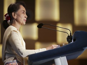 Myanmar's leader Aung San Suu Kyi delivers a lecture titled "Myanmar's Democratic Transition: Challenges and Way Forward" at the 43rd Singapore Lecture organized by the Institute of South East Asian Studies or ISEAS Yusof Ishak Institute on Tuesday, Aug. 21, 2018, in Singapore.