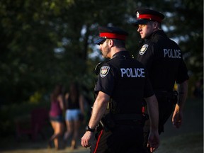 Two Ottawa police officers on foot patrol.