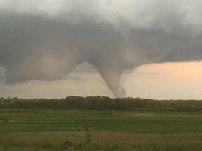 Pictures taken by Bryan Mozdzen of a tornado that touched down near Alonsa, Manitoba, on Friday, Aug. 3, 2018. Granda Koptyko's aunt went from that hurricane to the Ottawa one.