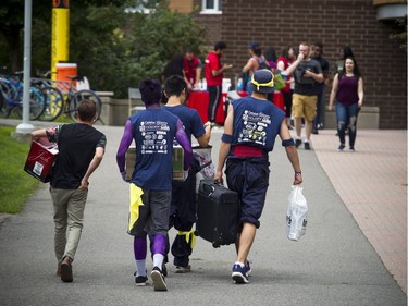 Students were busy moving into the residence buildings at Carleton University Saturday.