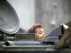 Five and half-year-old William Patte pokes his head out of the command post during a military vehicle demonstration that took place at the Canadian War Museum Saturday September 1, 2018.