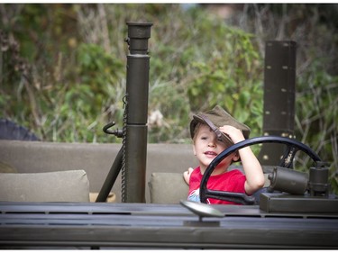 Three-year-old Nico poses for a photo during a military vehicle demonstration at the Canadian War Museum Saturday September 1, 2018.