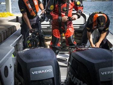 The OPP were on the St. Lawrence near Rockport Sunday September 2, 2018, searching for an 11-year-old Ottawa boy after a boat capsized Saturday afternoon. The OPP's Underwater Search and Recovery Unit suits up to do a dive down to the sunken boat.