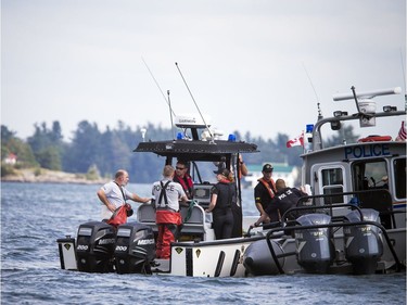 The OPP were on the St. Lawrence near Rockport Sunday September 2, 2018, searching for an 11-year-old Ottawa boy after a boat capsized Saturday afternoon. The OPP's Underwater Search and Recovery Unit suits up to do a dive down to the sunken boat.