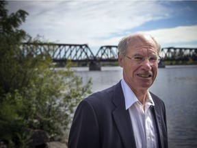 Clive Doucet, with the Prince of Wales bridge in the background, held a press conference recently to announce his transit plan.