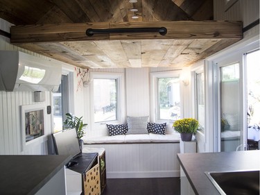 The living area of the Northern Nomad, with kitchen in foreground and sleeping loft, above.