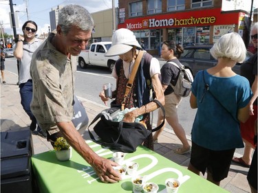 People try samples from "The Bowl" restaurant at the Taste of Wellington West event on Saturday. Patrick Doyle/Postmedia