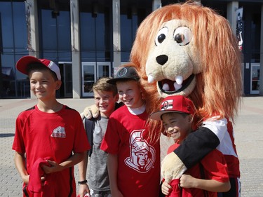 Fans pose for a photo with Spartacat at the Ottawa Senators Fan Fest at Canadian Tire Centre in Ottawa on Sunday, September 16, 2018.