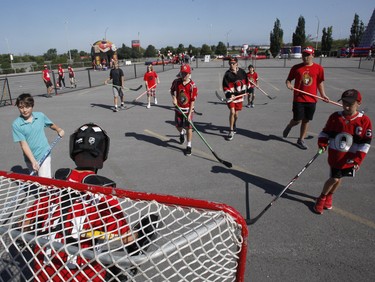 Kids play street hockey at the Ottawa Senators Fan Fest at Canadian Tire Centre in Ottawa on Sunday, September 16, 2018.