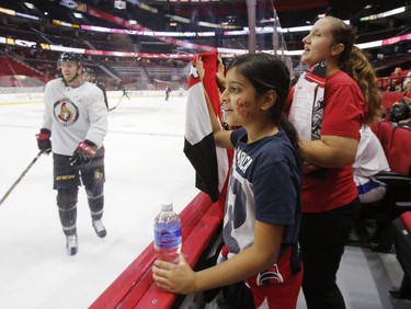 Surraya, 9, watches practice at the Ottawa Senators Fan Fest at Canadian Tire Centre in Ottawa on Sunday, September 16, 2018.   (Patrick Doyle)  ORG XMIT: 0917 fan fest 09