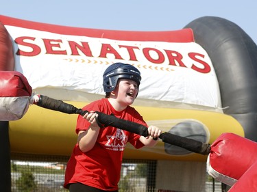 Audrey,10 , plays a jousting game at the Ottawa Senators Fan Fest at Canadian Tire Centre in Ottawa on Sunday, September 16, 2018.