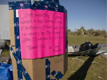 A sign offering free coffee, tea and food is posted at the corner of Dunrobin Rd and Thomas Dolan Pkwy Monday, September 24, 2018, as clean-up efforts continue two days after a tornado touched down in Dunrobin onFriday.
