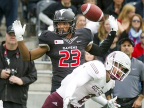 Nate Hamlin, during his days as a Carleton Raven, throws his hands up, professing his innocence, after breaking up a pass attempt.