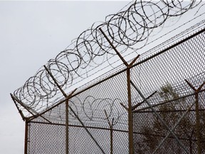 Barbed wire tops the fences of the Ottawa Carleton Detention Centre on Innes Road.