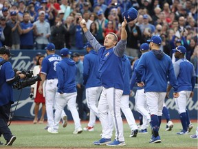 Manager John Gibbons of the Toronto Blue Jays salutes the fans after their victory and his final home game as manager after their MLB game against the Houston Astros at Rogers Centre on September 26, 2018.