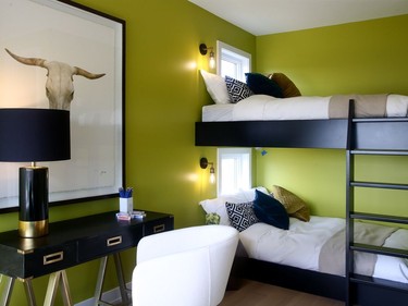 The boy's room is aimed at a teenager, with a fun but toned-down chartreuse on the walls, black accents for a masculine feel and over-sized double bunkbeds.  Julie Oliver/Postmedia